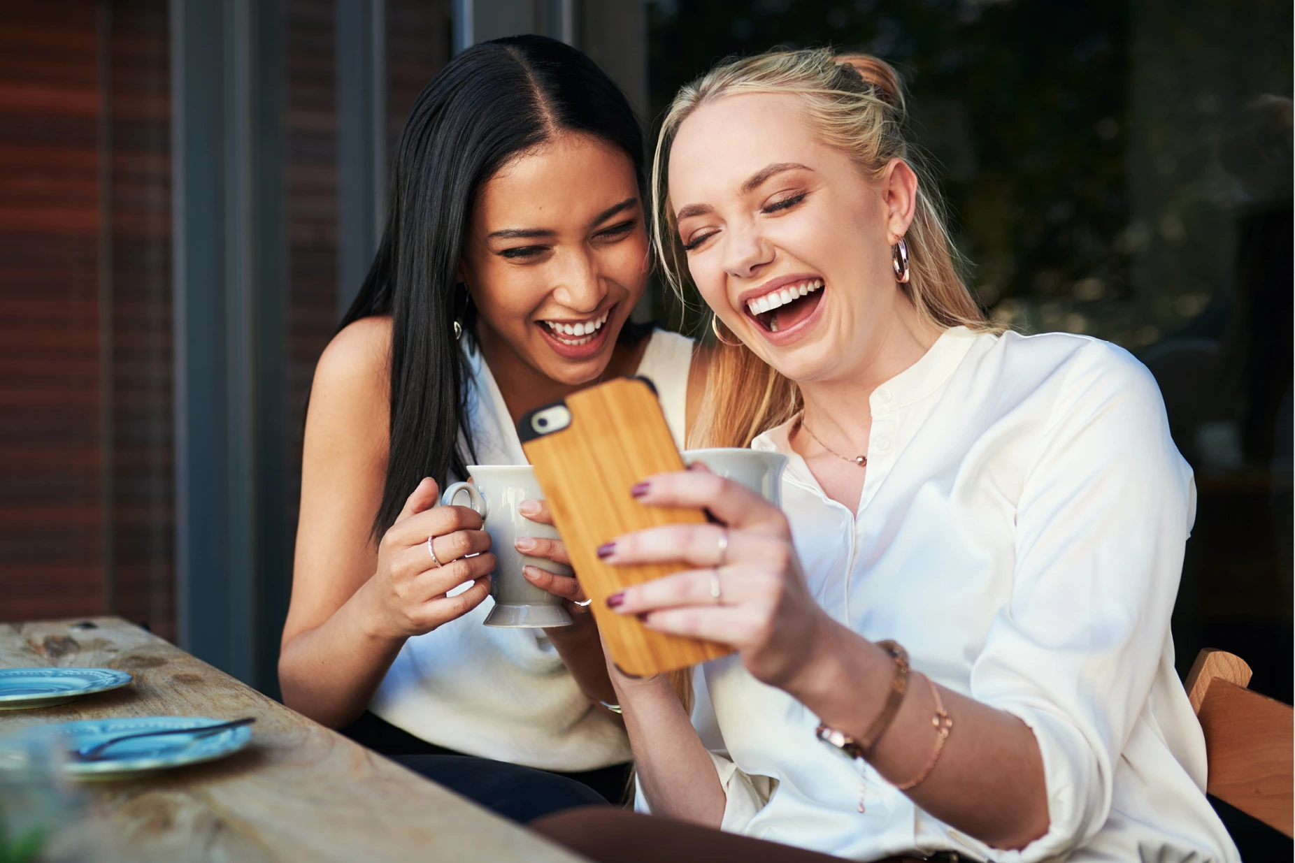 Two women looking at a phone